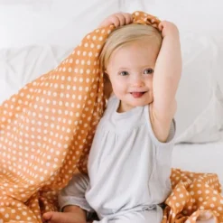 Mini Wander Polka Dot Amber Muslin Swaddle Swaddles + Blankets